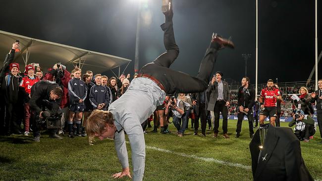 Crusaders coach Scott Robertson celebrates with a breakdance at AMI Stadium.