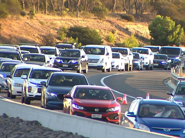 Two paramedics and a patient were injured when a truck and ambulance crashed on the Southern Expressway. Pictures: 7 News