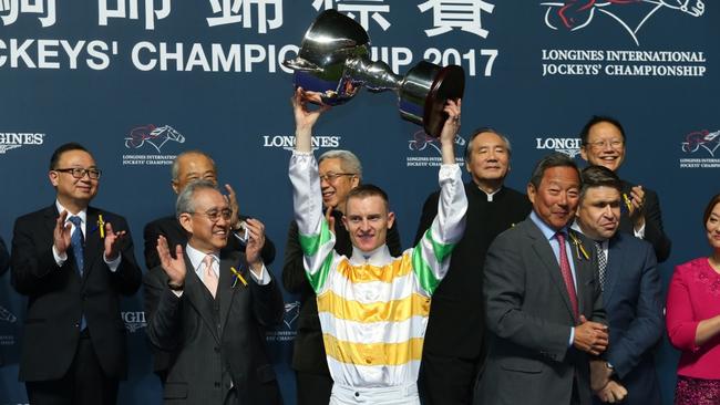Zac Purton poses with the trophy after winning Jockeys championship during Longines Hong Kong International Jockey Championship.
