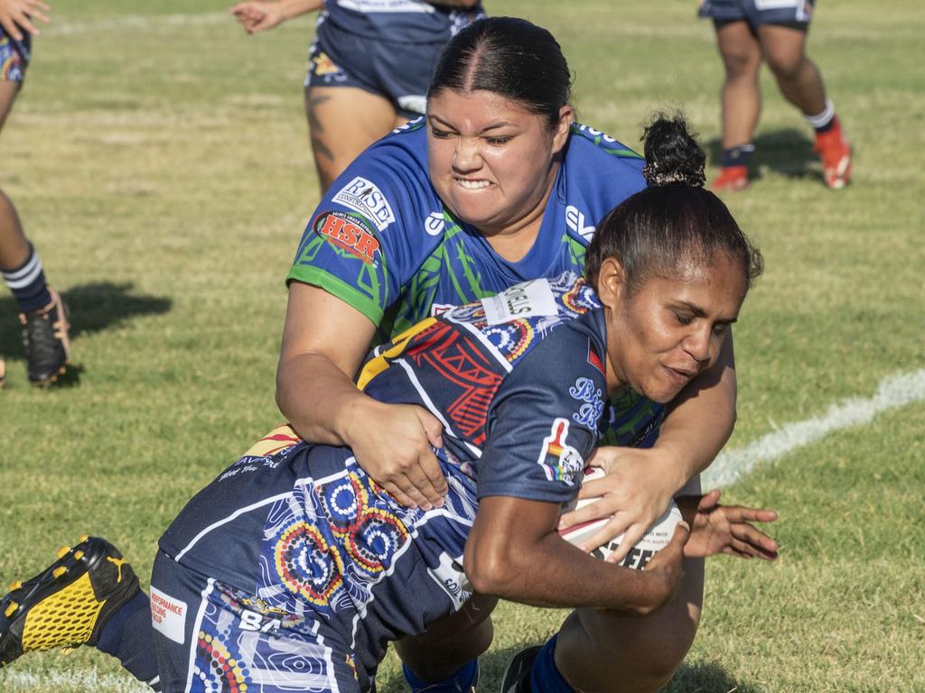 Clarissa Janes for Pacific tackles Lorna Murray for Emus. 2023 TRL Cultural Cup, Open Womens SW Qld Emus vs Pacific Nations Toowoomba. Saturday, February 25, 2023. Picture: Nev Madsen.