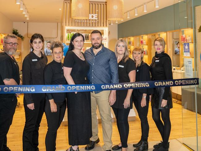 Isa Hagstrom (centre) with Just Cuts Rose City staff at the grand opening last year (Photo: supplied)