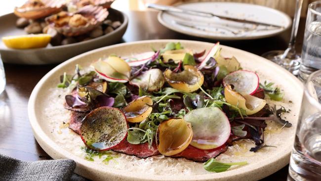 Eye fillet carpaccio with York Town greens, shaved grand padano, charred pickling onions, and dried capers. Picture: Stephanie Dalton