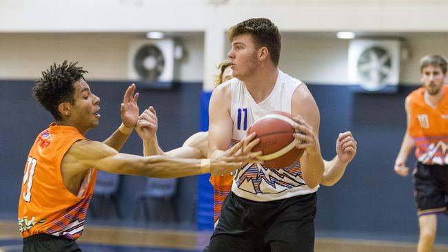 Hayden Maripa (left) of Westridge Fruit and Veg Warriors and Isaac Wormald of Washed on James Mustangs in Toowoomba Basketball League round five at Clive Berghofer Arena, St Mary's College, Monday, November 23, 2020. Picture: Kevin Farmer