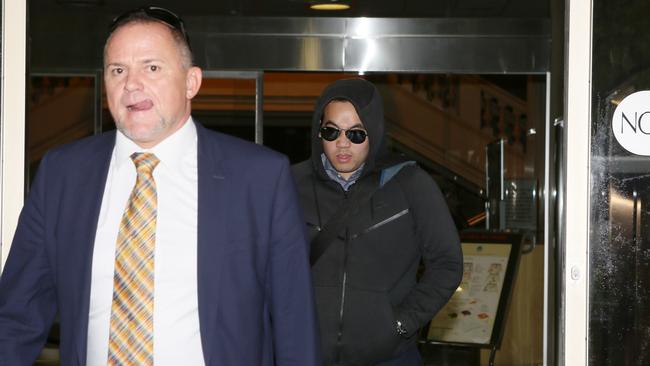 Alexander Anh Nguyen Tran, right, leaves court with lawyer Tim Dibden. Picture: AAP/Emma Brasier.