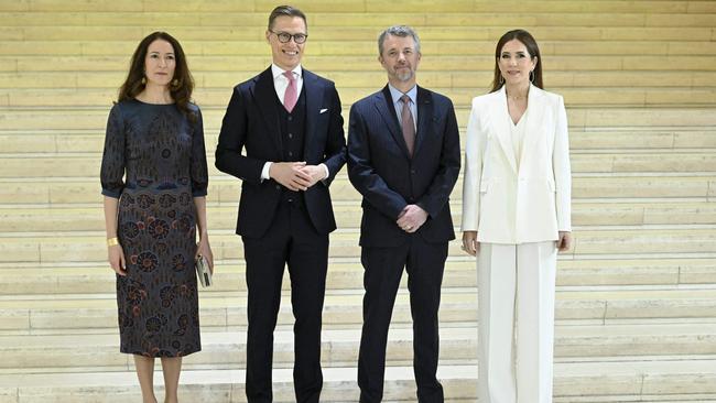 King Frederik and Queen Mary of Denmark pose for a picture with the guests Finland's President Alexander Stubb and his wife Suzanne Innes-Stubb. Picture: AFP