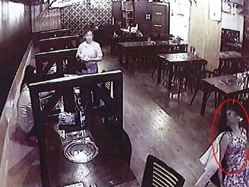 Supplied CCTV images from Korean BBQ bar restaurant Gangnam Station showing one of the women passed out in her chair.