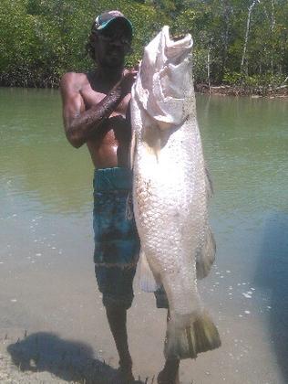 BIG HAUL: Aurukun local Stanley Watt with the 1.4m barra he caught in October. PICTURE: SUPPLIED