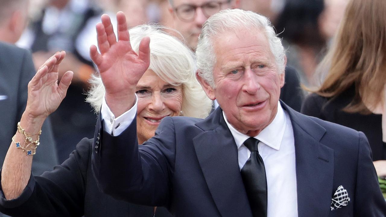 King Charles III greets the crowd upon their arrival Buckingham Palace in London (Photo by Chris Jackson/Getty Images)