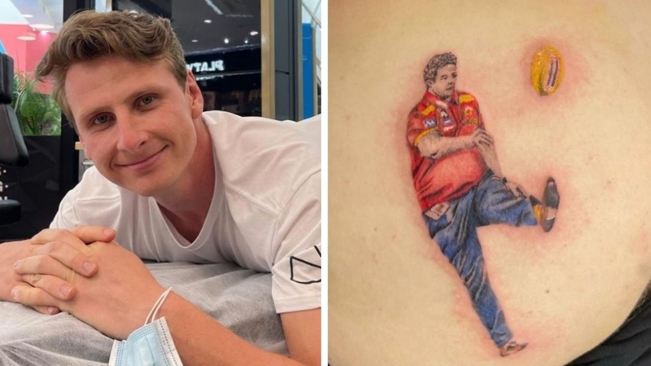 Daniel Gorringe now has a tattoo of Gold Coast Suns coach Stuart Dew on his backside.