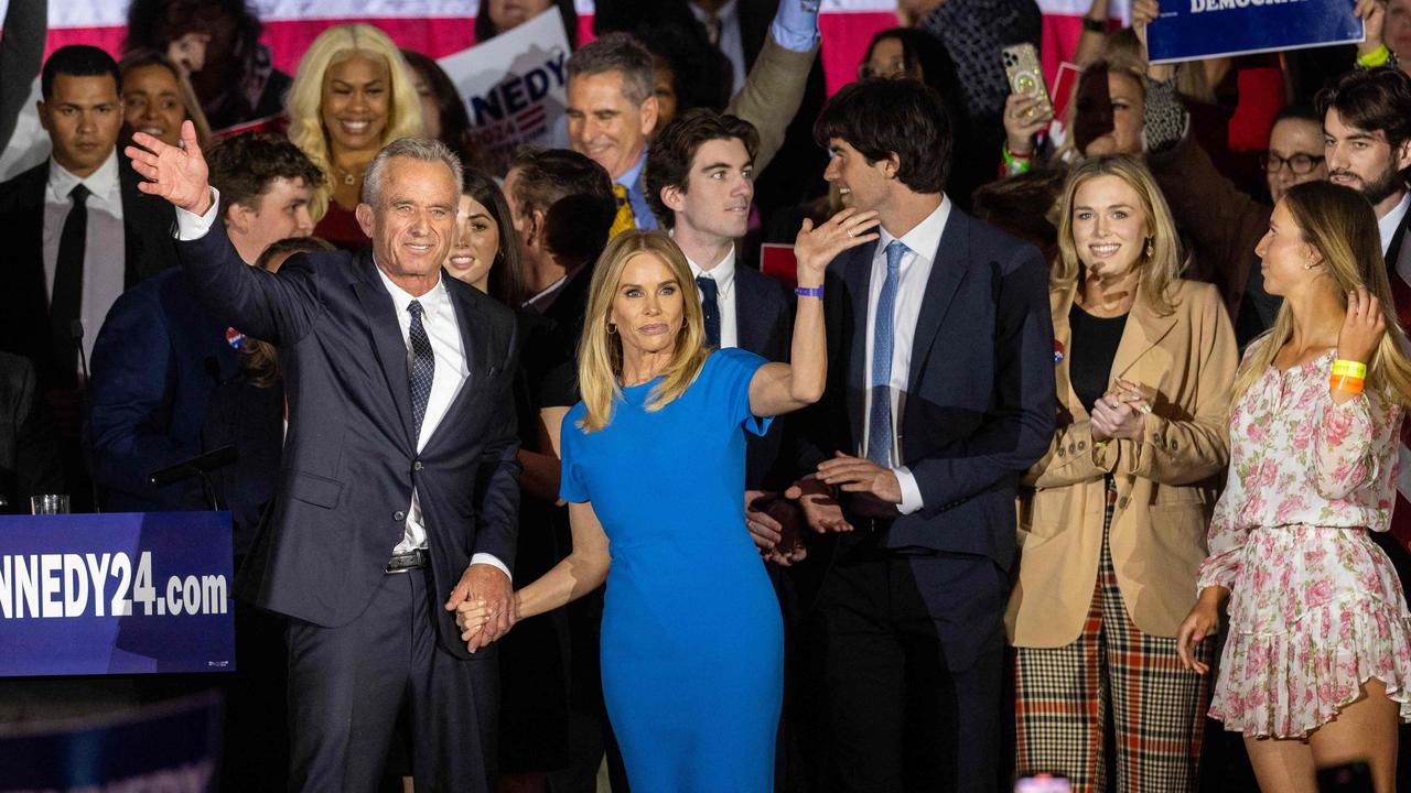 Robert F. Kennedy Jr and his wife actress Cheryl Hines wave to supporters on stage after announcing his candidacy for president in April. Picture: AFP