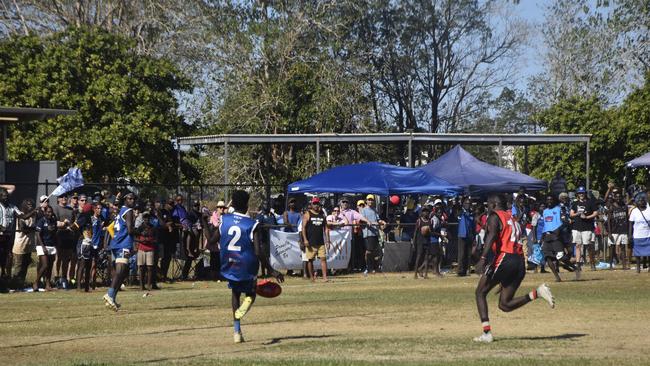 William Pupungamirri kicks for the Buffaloes. Picture: Max Hatzoglou