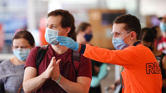 Travellers arriving from Sydney transit through quarantine after landing at Adelaide Airport on Friday. Picture: NCA NewsWire / David Mariuz