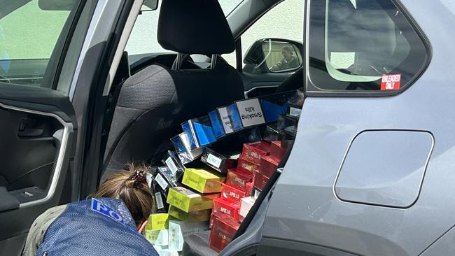 Police seized cigarettes from ASG Smokes and Gifts at Rosewater after the store was subjected an attempted arson attack overnight. Picture: Natalie Vikhrov