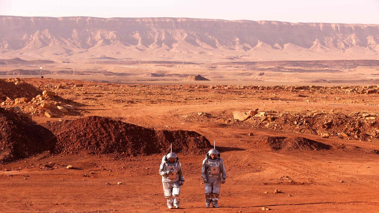 Astronauts-in-waiting: members of the European-Israeli team walk in spacesuits during a training mission for planet Mars that simulates life on the red planet in Israel's southern Negev desert. Six astronauts will be cut off from the world for a month, only able leave their habitat in spacesuits as if they were on Mars. Picture: AFP