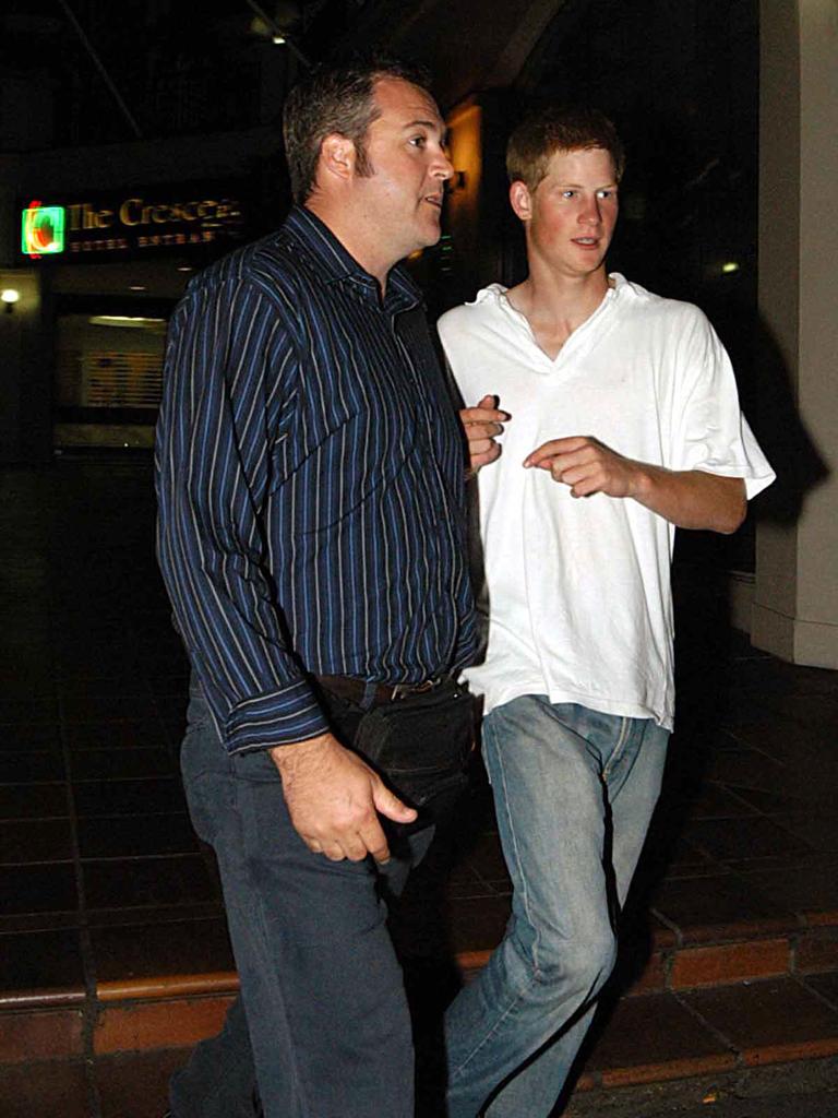 Wearing oversized denim and a white T-shirt in 2003, while leaving Kings Cross nightclub Hugo's Lounge.