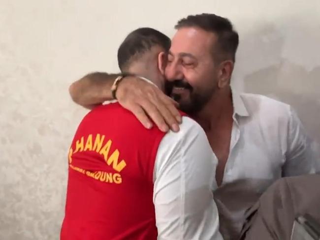 Mohamed Rifai hugs his dad after todays court ruling