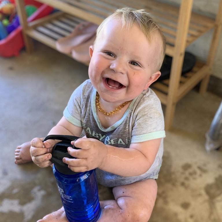 Archie Smith gardening with mum on a hot day. Picture: Jenna Smith