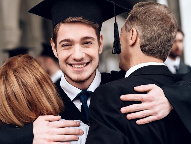 CAREERS. Parents congratulate the student, who finish their studies at the university. He graduates. They are very happy about this. University graduate. Picture: iStock