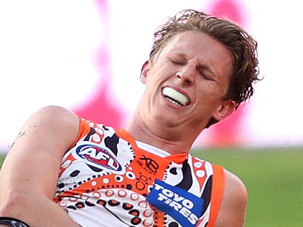 Giants Lachie Whitfield injured during AFL match between the GWS Giants and Gold Coast Suns at Giants Stadium. Picture. Phil Hillyard