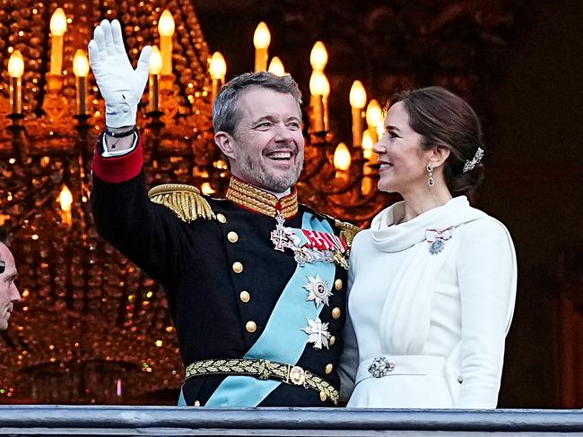 COPENHAGEN, DENMARK - JANUARY 14: King Frederik X and Queen Mary of Denmark wave from the balcony of Amalienborg after being proclaimed as King and Queen Denmark on January 14, 2024 in Copenhagen, Denmark. Her Majesty Queen Margrethe II steps down as Queen of Denmark and and entrusts the Danish throne to His Royal Highness The Crown Prince, who becomes His Majesty King Frederik X and Head of State of Denmark. (Photo by Martin Sylvest Andersen/Getty Images)