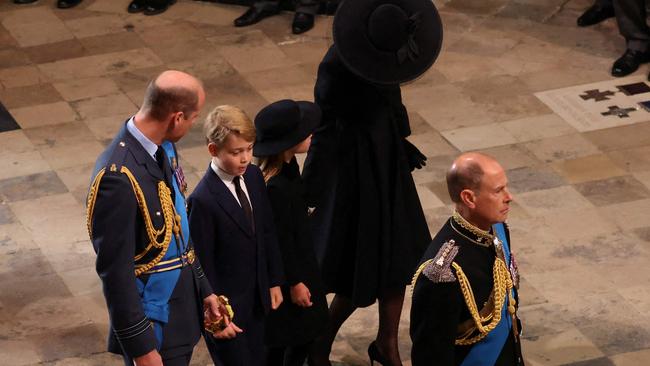 Prince of Wales, Prince William, his children Prince George and Princess Charlotte and Catherine, Princess of Wales, follow the Queen’s coffin into Westminster Abbey. Picture: AFP