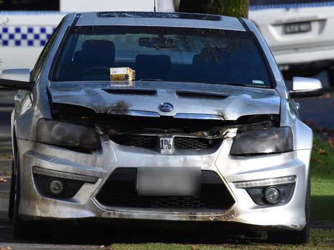 A car firebombed at the front of the property on Warrain Street. Picture: Nicole Garmston