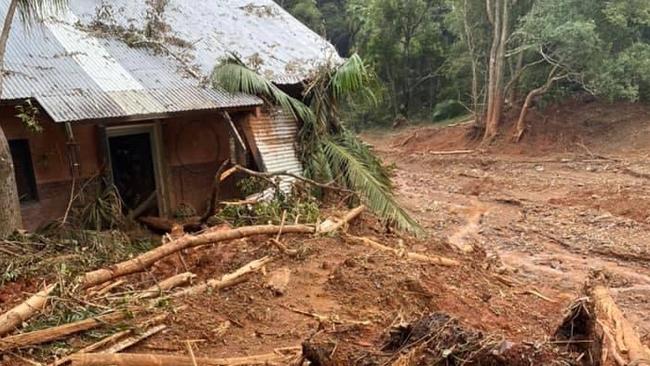 A landslide crushes an Upper Burringbar house.