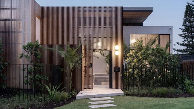 The five-bedroom, six-bathroom house features three types of stone, Italian travertine flooring and blackbutt timbers.