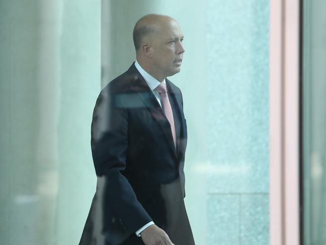 Home Affairs Minister Peter Dutton walking to the party room meeting. Picture: Kym Smith