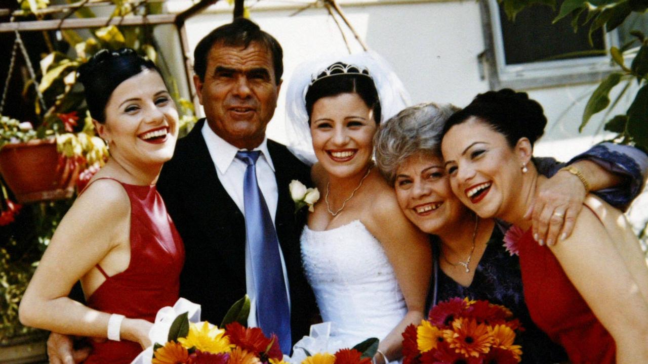 Maria Kotronakis on her wedding day with Dimmy Kotronakis, Elizabeth (far right) and their parents.