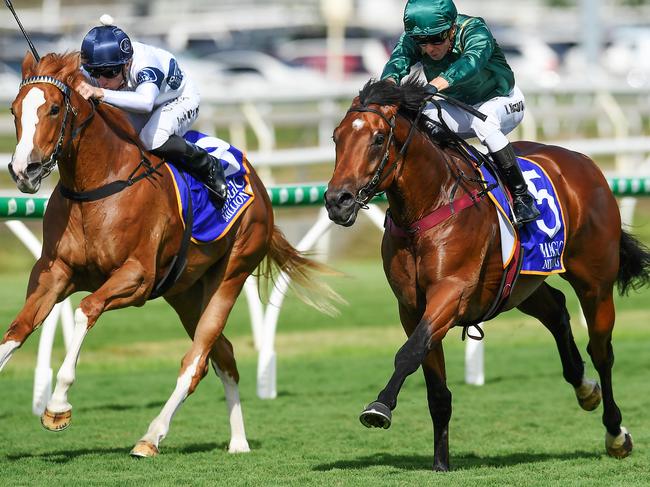 Jockey Kerrin McEvoy rides King’s Legacy (right) to victory in the B.J. McLachlan Stakes.