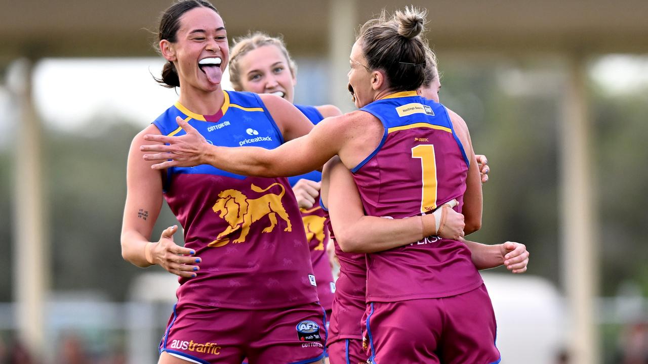 The Lions celebrate Emily Bates’ goal against the Pies. Picture: Getty Images