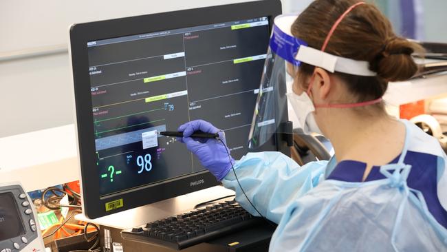 A nurse at a monitoring station for the most chronically ill patients. Picture: David Caird