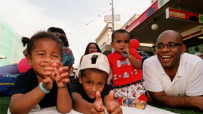 Ema Evora, 3, Koto Pati, 5, Brandon, 10 months, and Jose Evora at live Olympic site in Parramatta on September 17, two days after the Games started. Picture: Lindsay Moller