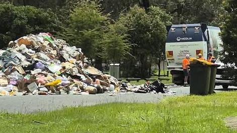 A Brisbane garbage truck collector was forced to dump the entire rubbish load on an Inala street earlier this morning. Picture: Brenden Dillon Baker