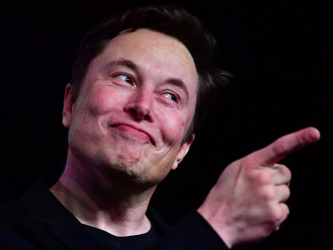 (FILES) In this file photo taken on March 14, 2019, Tesla CEO Elon Musk speaks during the unveiling of the new Tesla Model Y in Hawthorne, California. - Elon Musk's decision to pull Twitter off the stock market allows him to make major changes quickly, but it also takes the company more heavily into debt, a risky choice for a money-losing business. (Photo by Frederic J. BROWN / AFP)