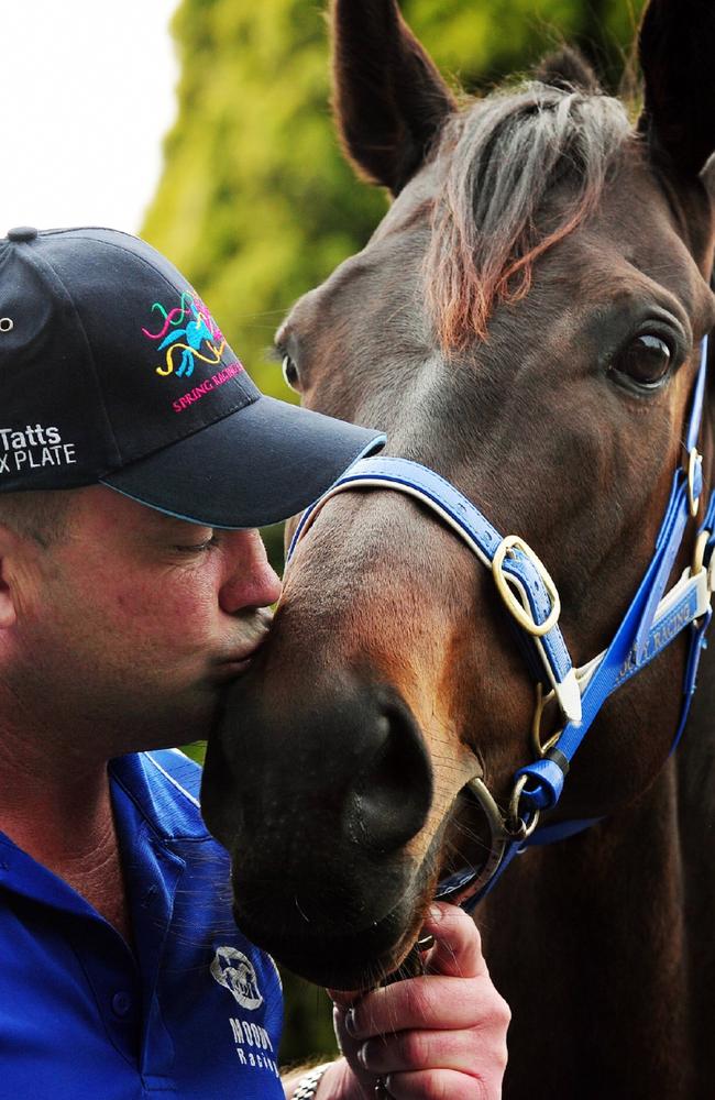 Peter Moody kisses champion mare Black Caviar in 2011. Picture: Colleen Petch