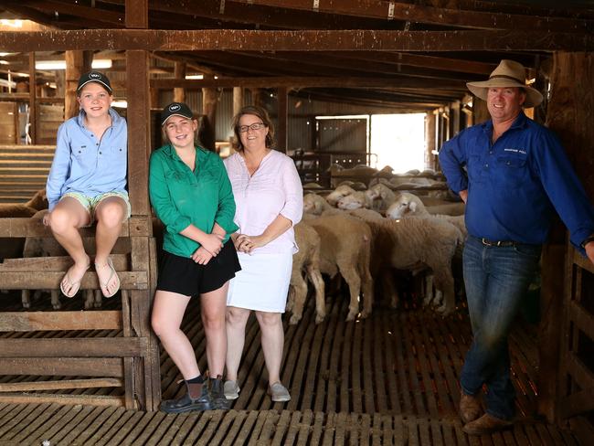 Profit driven: Steve and Carol Huggins with daughters Olivia and Isobel on their property at Hay in the NSW Riverina. Picture: Andrew Rogers