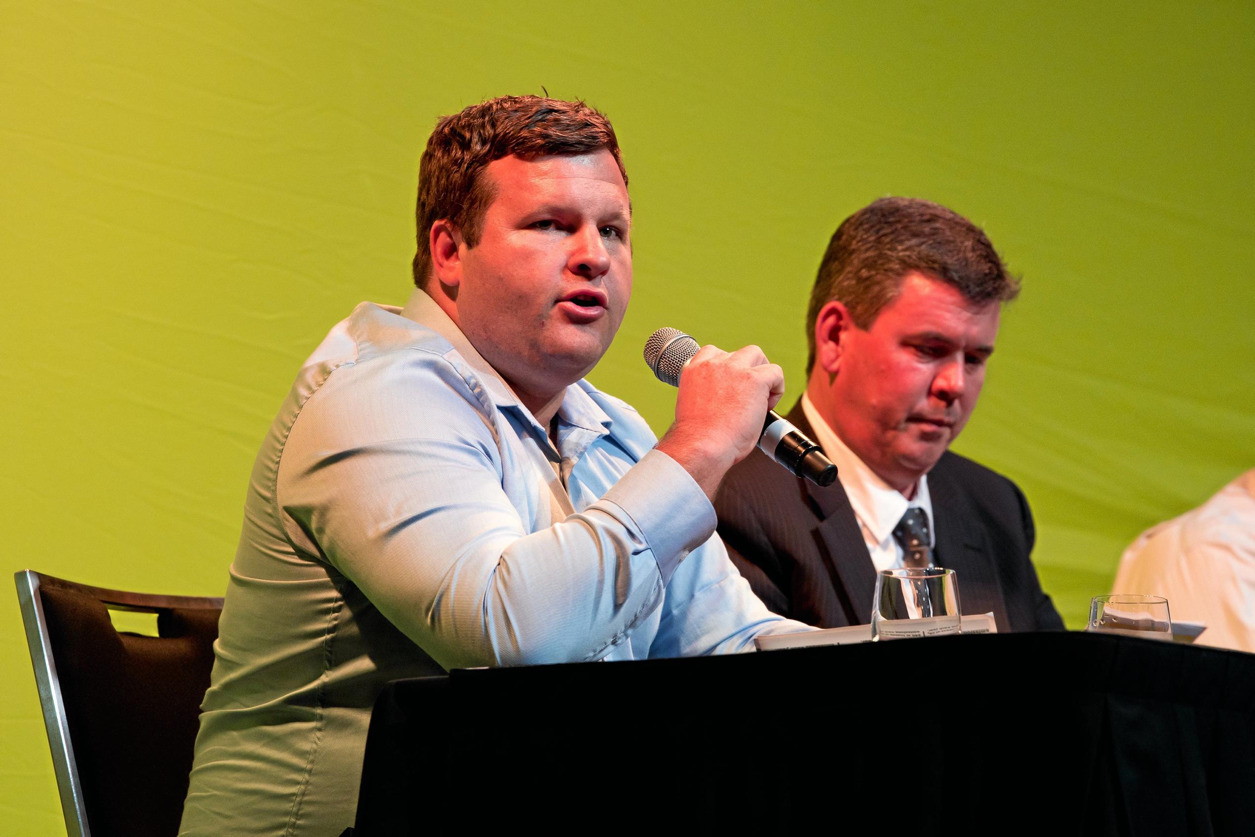 Katter's Australia Party candidate Brendan Bunyan speaks at the 2019 Dawson Debate flanked by United Australia Party candidate Colin Thompson.