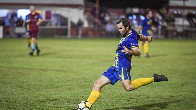 Matt Twyford kicks the ball forwards for the Waves.