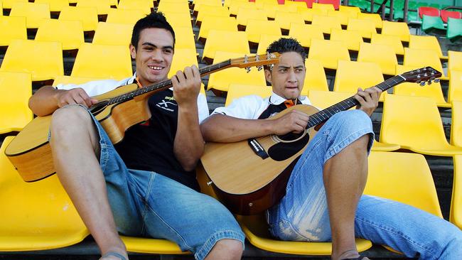 West Tiger players Dean Halatu and Benji Marshall are pictured at Concord oval playing guitar during a training session. 1/4/04 Picture: James Horan