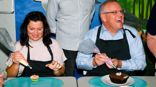 The Morrisons enjoy a cake decorating session at Canefield Clubhouse, which offers rehabilitation programs for adults suffering mental illness. Picture: Mick Tsikas/AAP