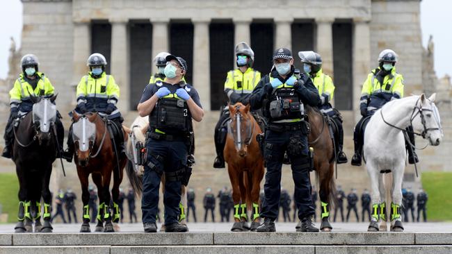 Police turn out in force at the anti-lockdown protest near the Shrine of Remembrance. Picture: Andrew Henshaw