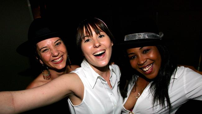 31 Dec 2004 New Year's Eve in Brisbane Michelle Hyams, Laura Griffith and Sandrine Auguste at the 1950s party at the Exhange. PicMark/Calleja headshot celebrations