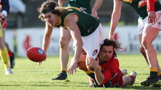 Jacey Winter is tackled by Josh Poulter. Picture: George Salpigtidis