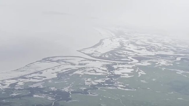 Flooded Far North Queensland roads filmed by Daintree Air as they fly in fresh food supplies to Coen