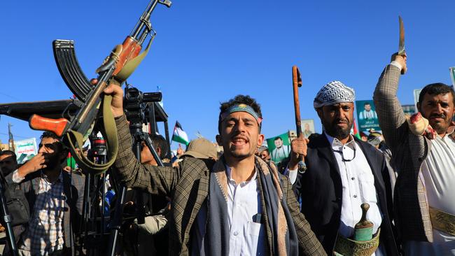 Armed Yemenis chant slogans during a march in solidarity with the people of Gaza on November 24, 2023, in the Houthi-controlled capital Sanaa.