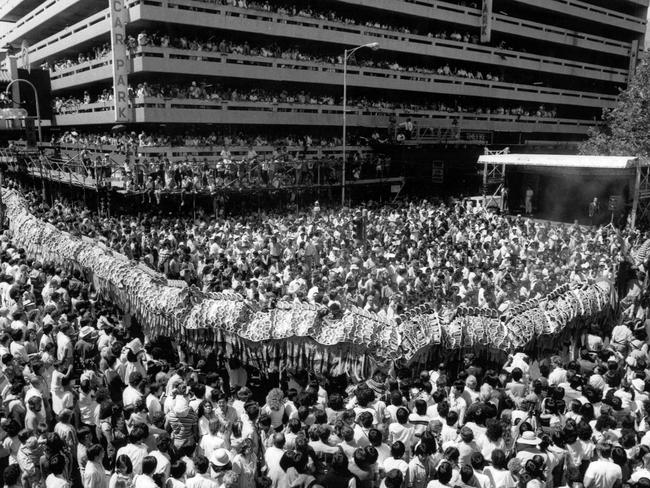 Chinatown welcomes The Year of the Ox as Dai Loong, the Chinese dragon, weaves it's way through the crowd in Little Bourke St in 1985. Picture: HWT Library.