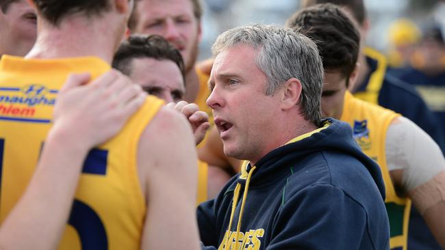 Eagles coach Michael Godden addresses his charges. Photo: Tom Huntley