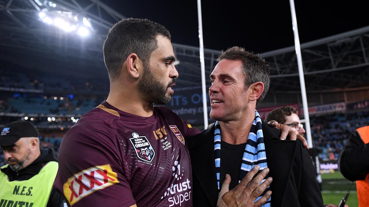 Greg Inglis shares a moment with Blues coach Brad Fittler.